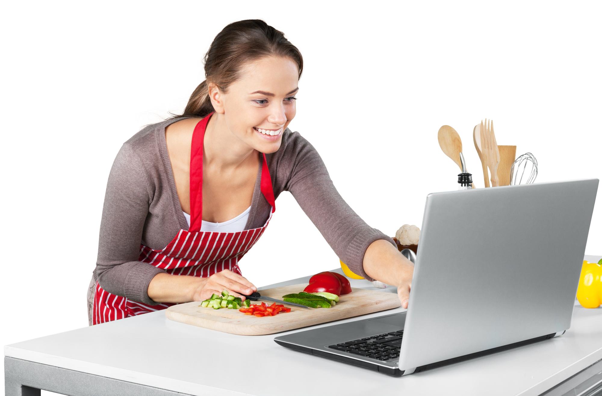 Student with a laptop following a cooking lesson
