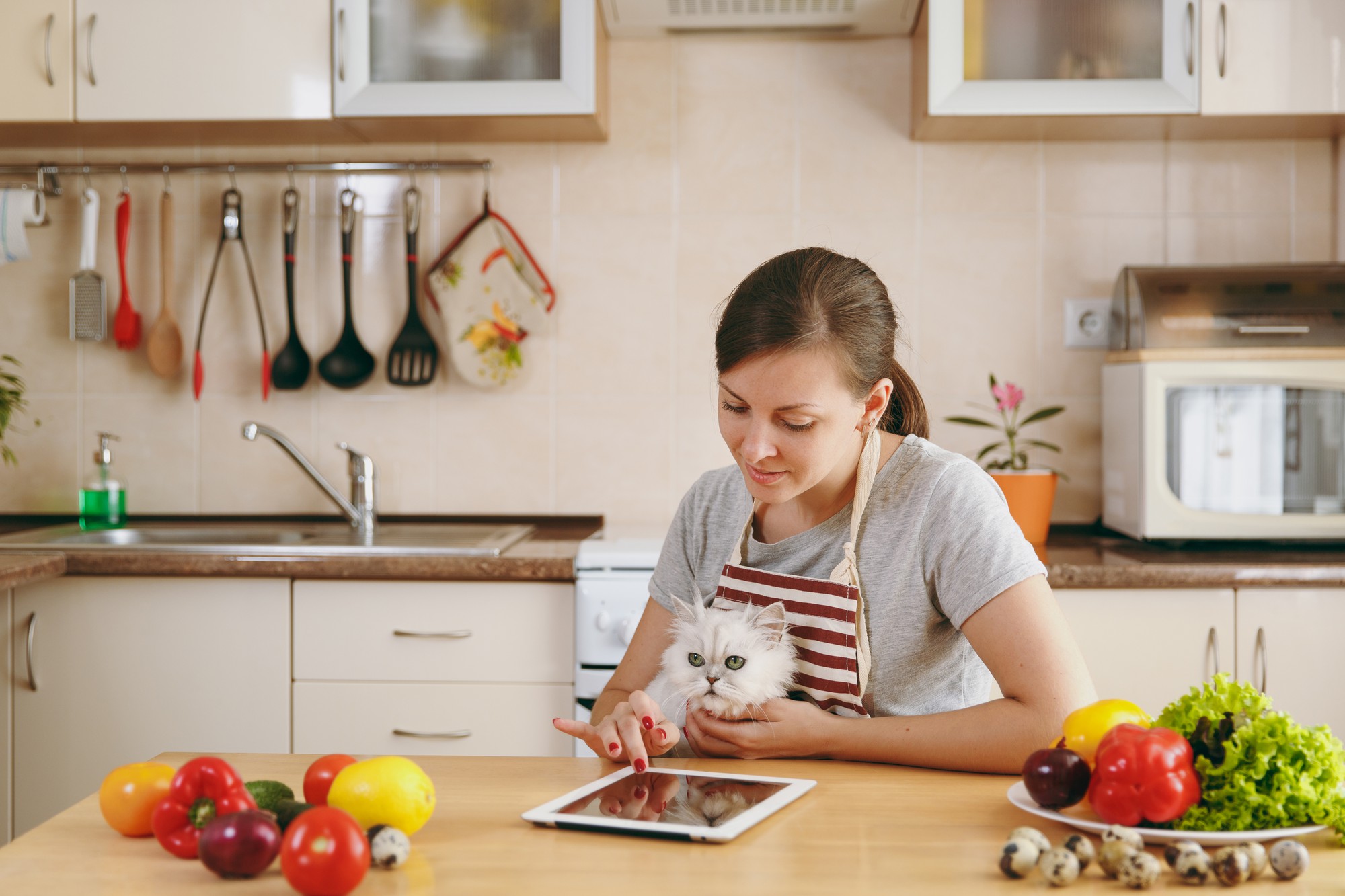 Student cooking in a small kitchen